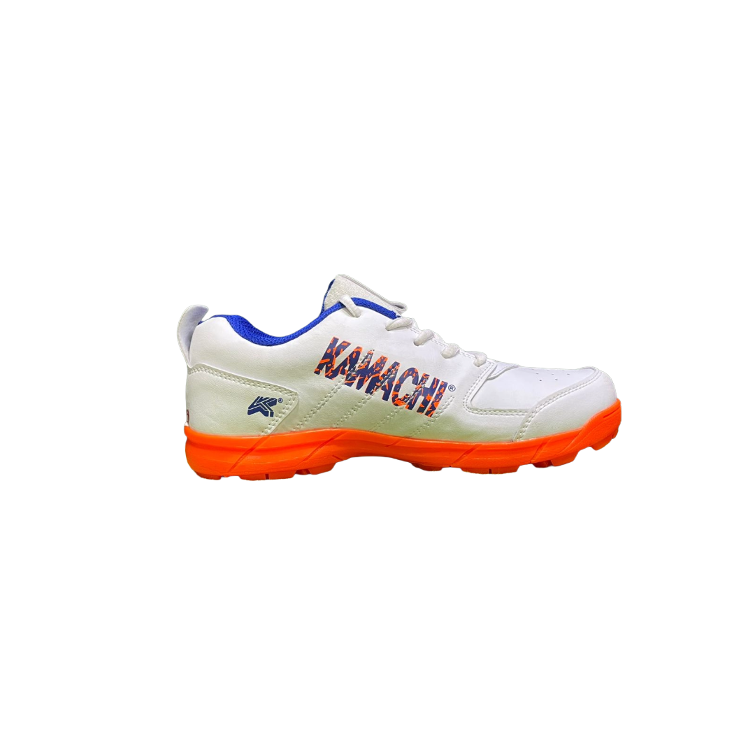 White Kamachi C-10k Cricket Shoes inner side view with orange sole and blue accents on a white background